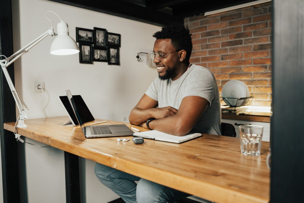 Young man working from home on laptop